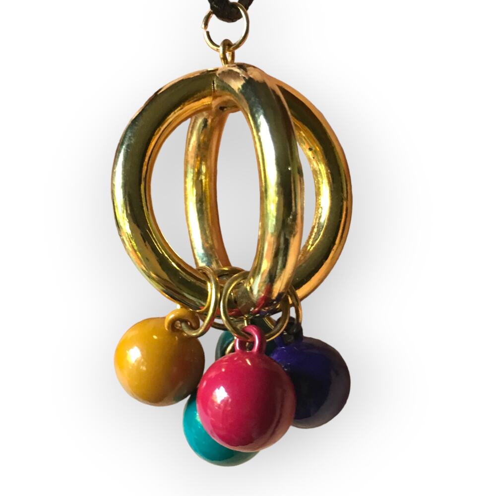 Unique golden cage and bright bauble pendant necklace